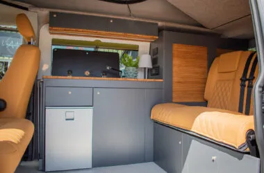 Pumpkin coloured furnishings in campervan