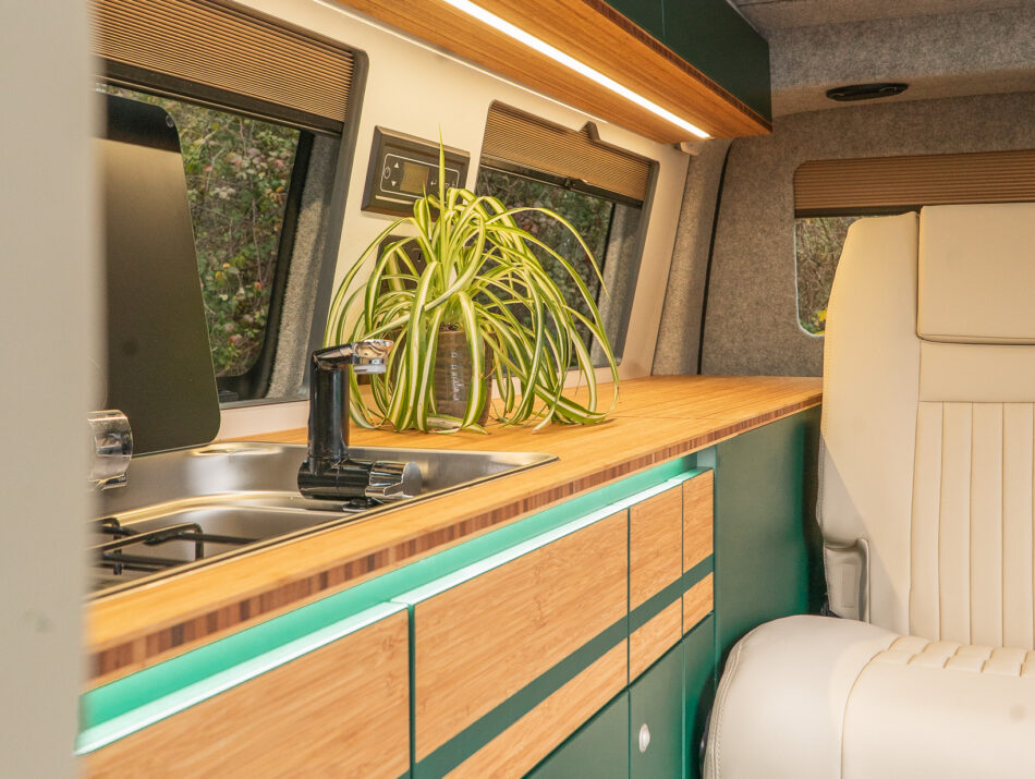 Green Furnishing with beige seating in campervan