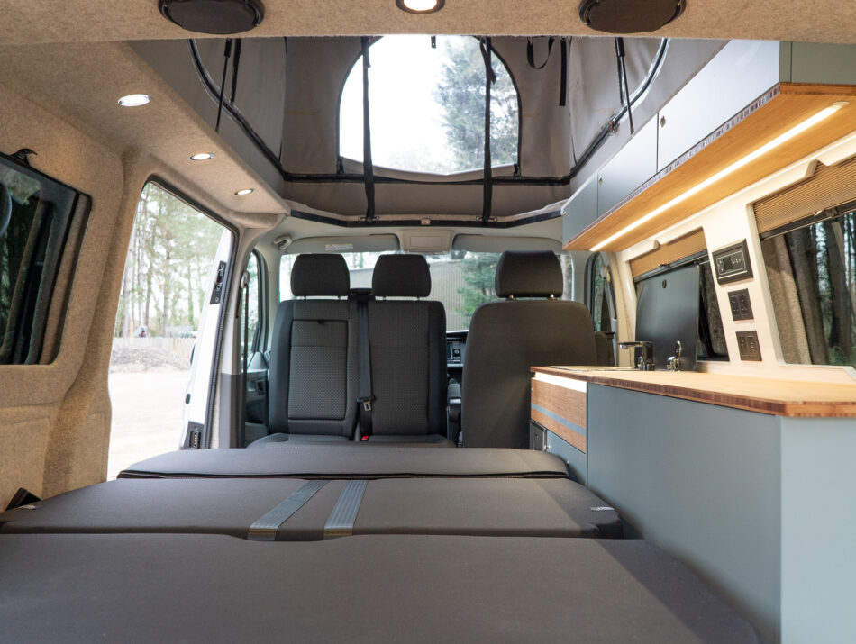 Folded seating inside lit campervan